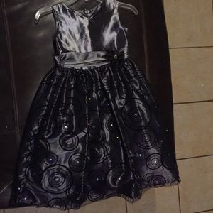 I’m selling a gray dress with designs on it.